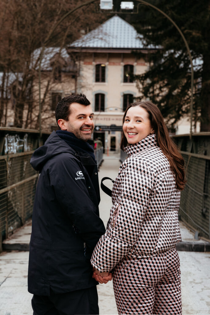 Couple walking hand-in-hand through Chamonix after their elopement wedding